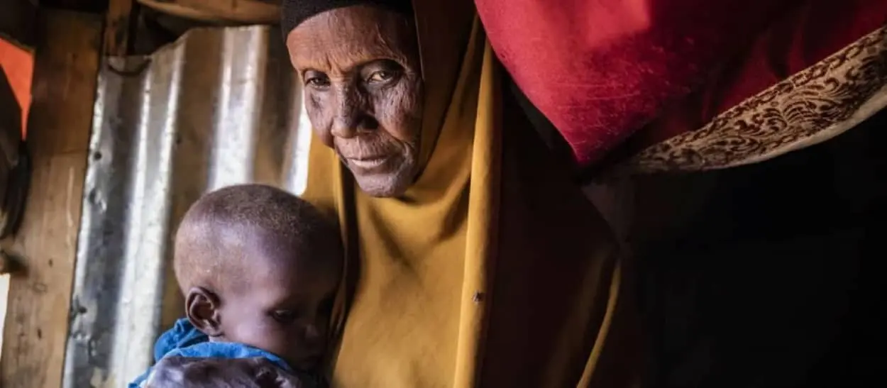 Samiro with her grandchild, Calaso at a settlement for internally displaced people, near Baidoa, Somalia.
