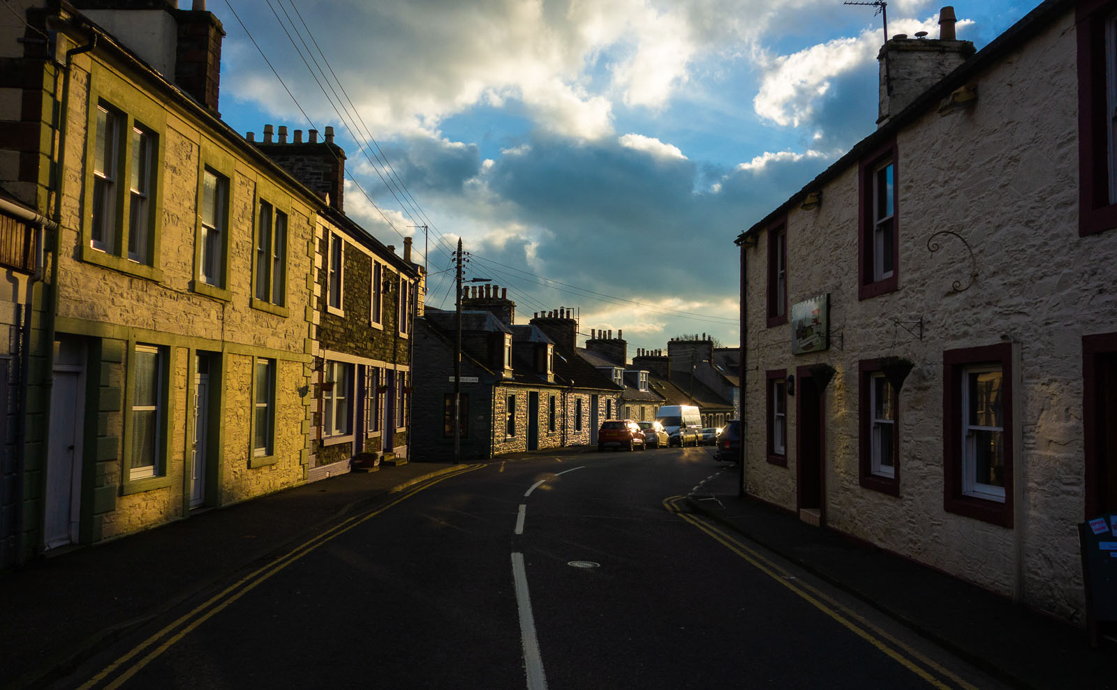 bright sunrise over the buildings of wigtown