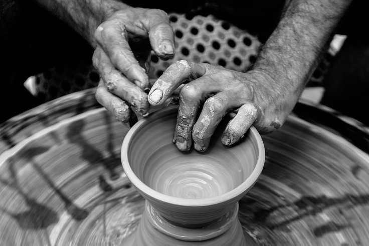 A person molding clay