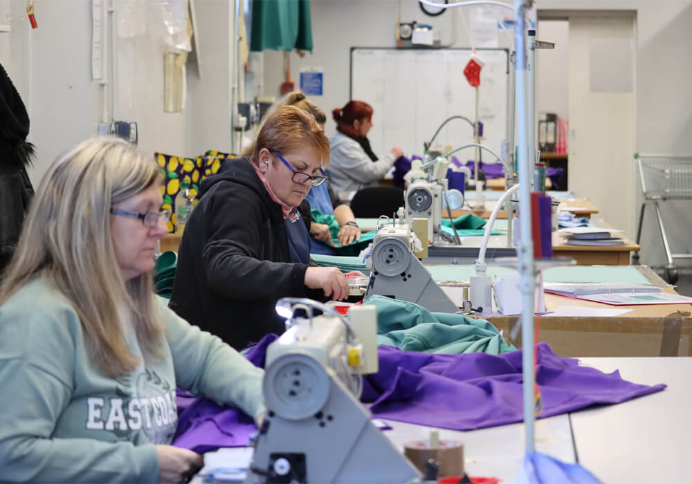 Workers at ANZE manufacturing reusable surgical gowns