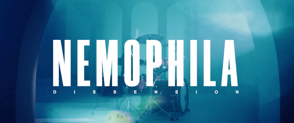 A hazy, blue-tinted stage with a drum set and a drummer in action. Set in big, white letters: NEMOPHILA DISSENSION.