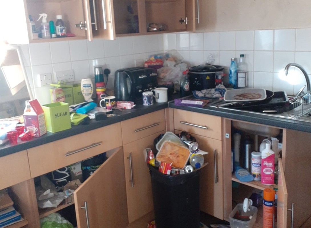 untidy kitchen after squatters