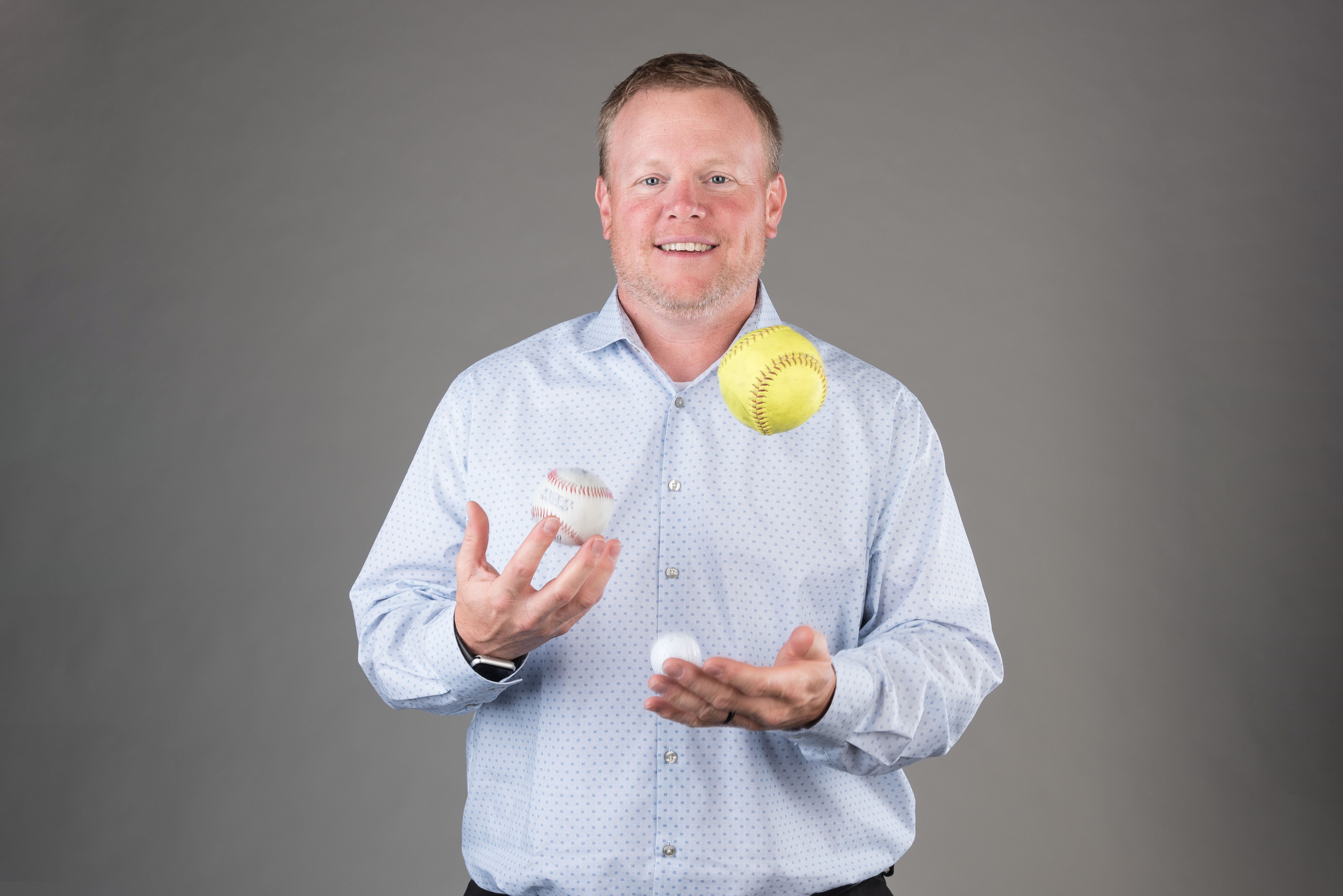 Portrait of man juggling