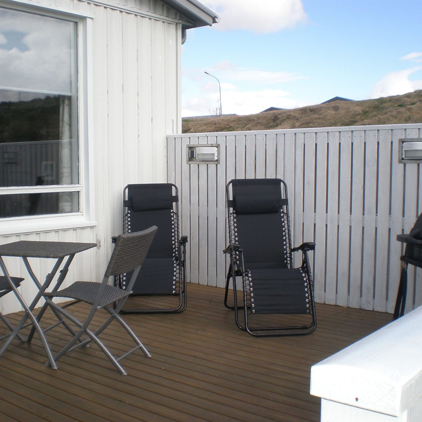 On the sheltered terrace there is garden furniture and a gas grill