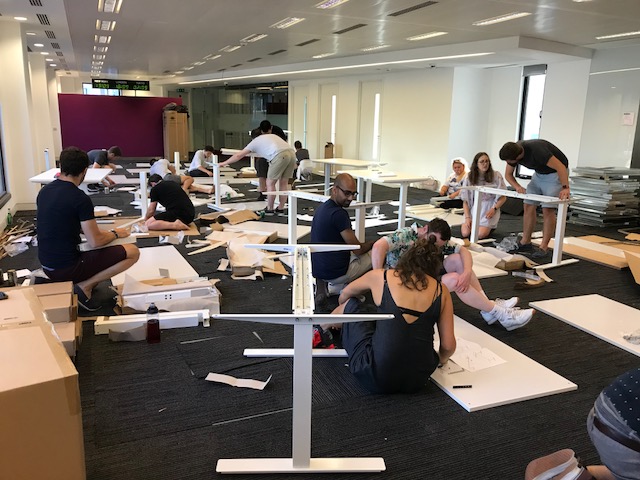 Photo of Monzo staff building IKEA furniture