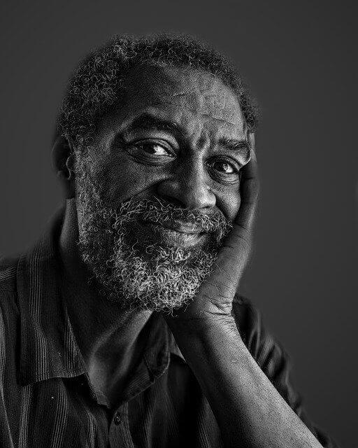 black and white portrait of smiling man