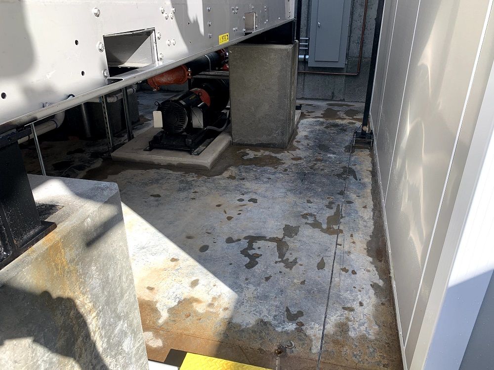 enlarged photo of before picture of a concrete floor and generator
