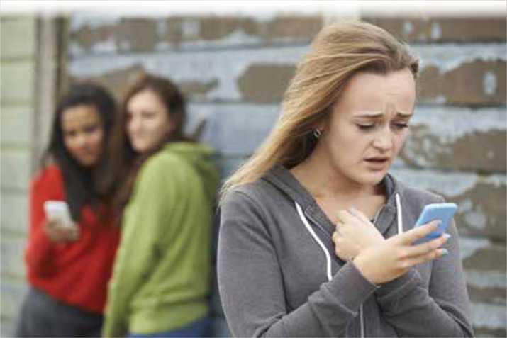 Girl receiving a mean text message from cyber bullies Girl receiving a mean text message from cyber bullies