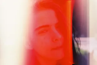 Woman with orange streak across her face