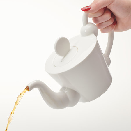 Pouring tea from the Denmark teapot, demonstrating that it pours well with no drips.