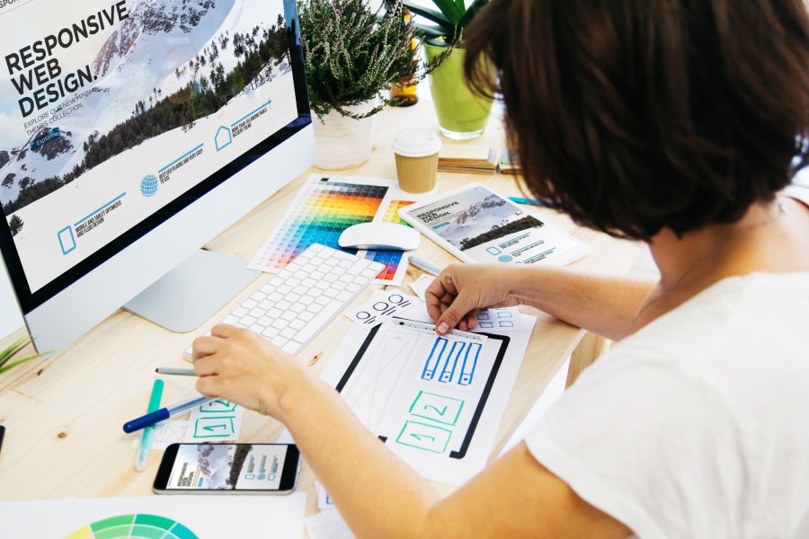 a graphic designer engaging in the web design process of digital marketing at one of the web design firm companies in Austin, Tx