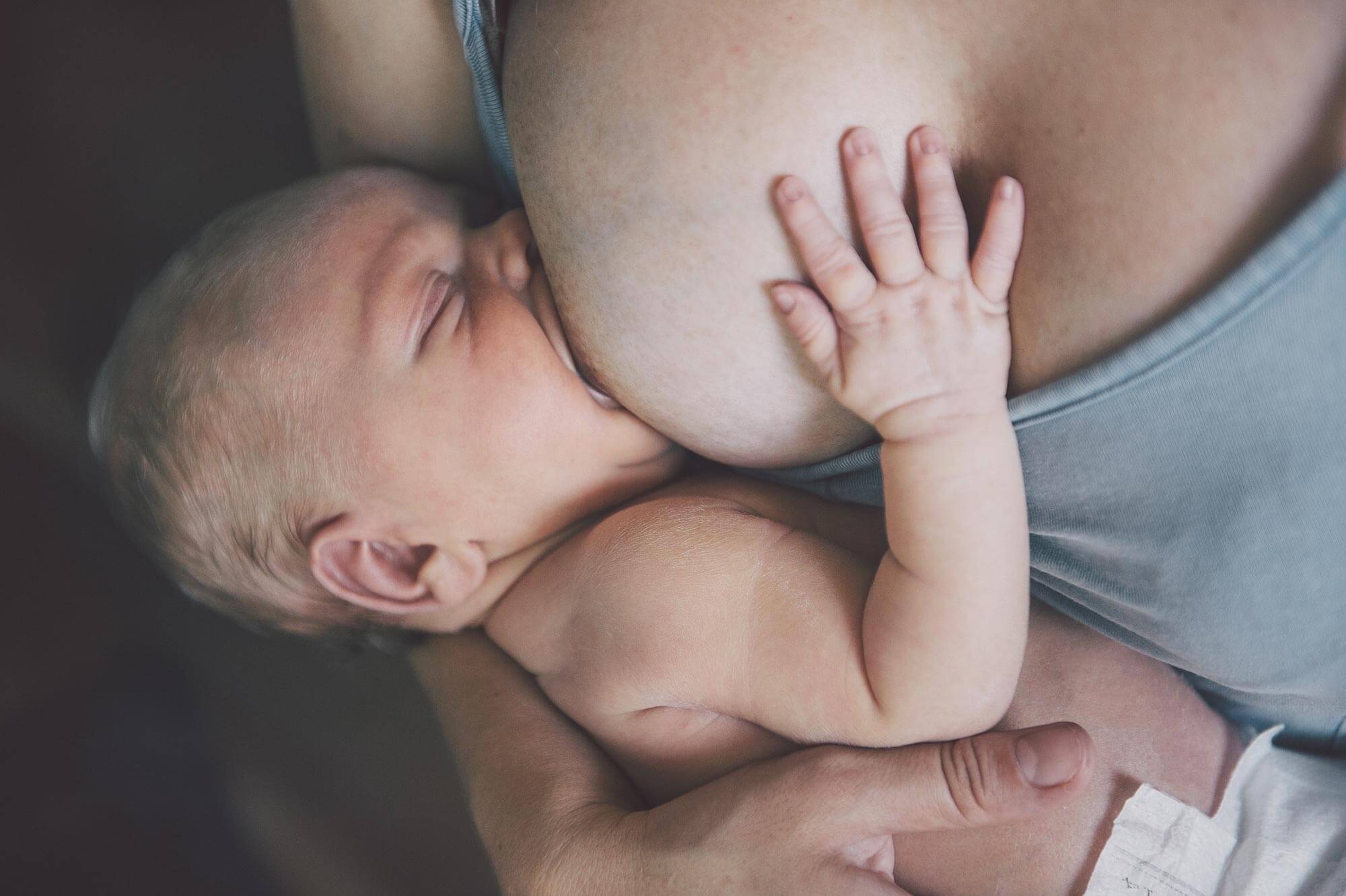 Mother breastfeeding her newborn.