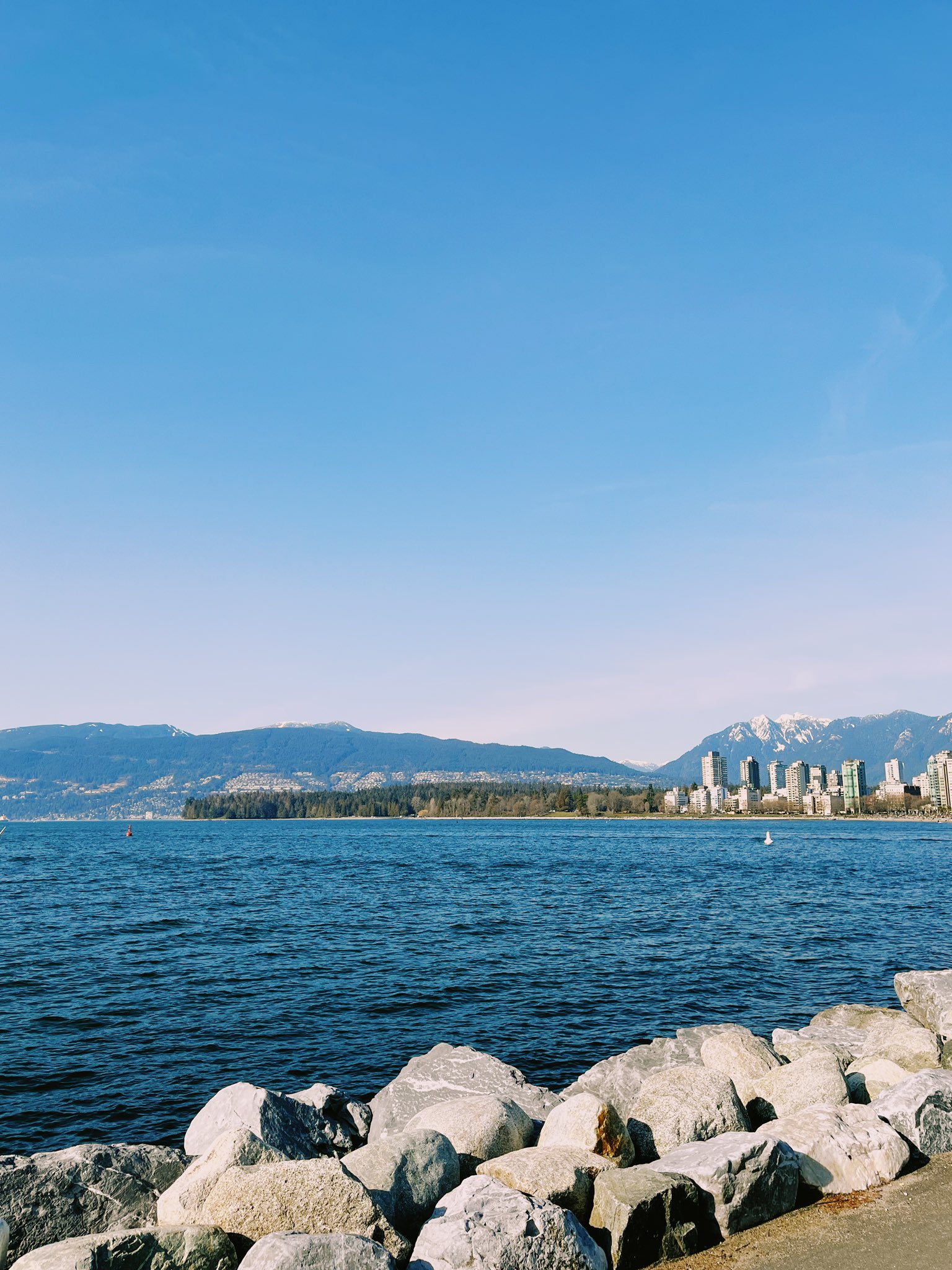 Water and mountains skyline in Vancouver on a sunny day.