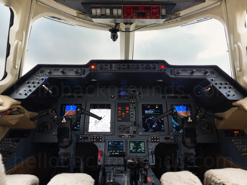 Private jet cockpit interior with clear view of instrument panels and controls Zoom background