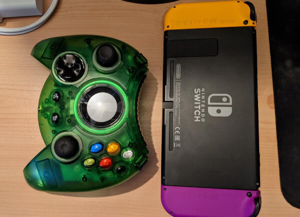 Comparing the size of the Hyperkin Duke controller to a Nintendo Switch - the Hyperkin Duke is bulkier than the Switch, for sure
