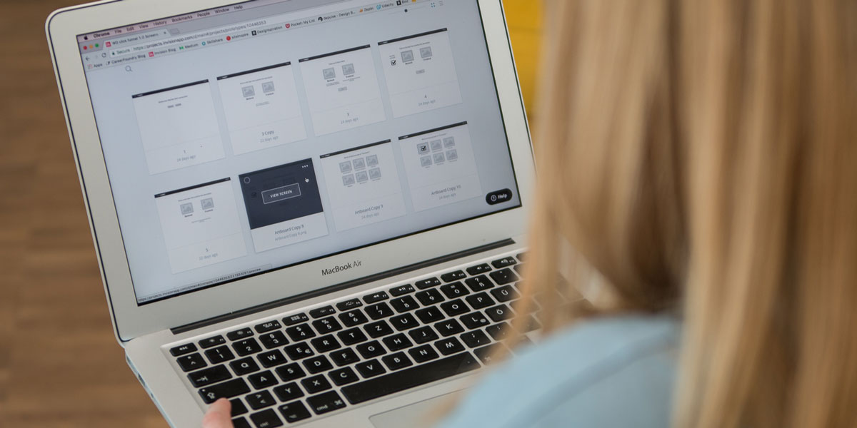 A UI designer looking at a laptop screen A user interface designer looking at her laptop screen