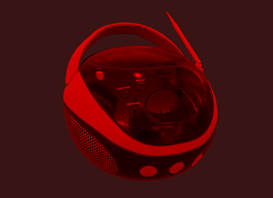 A 3D model of a boom box colored red through a shader