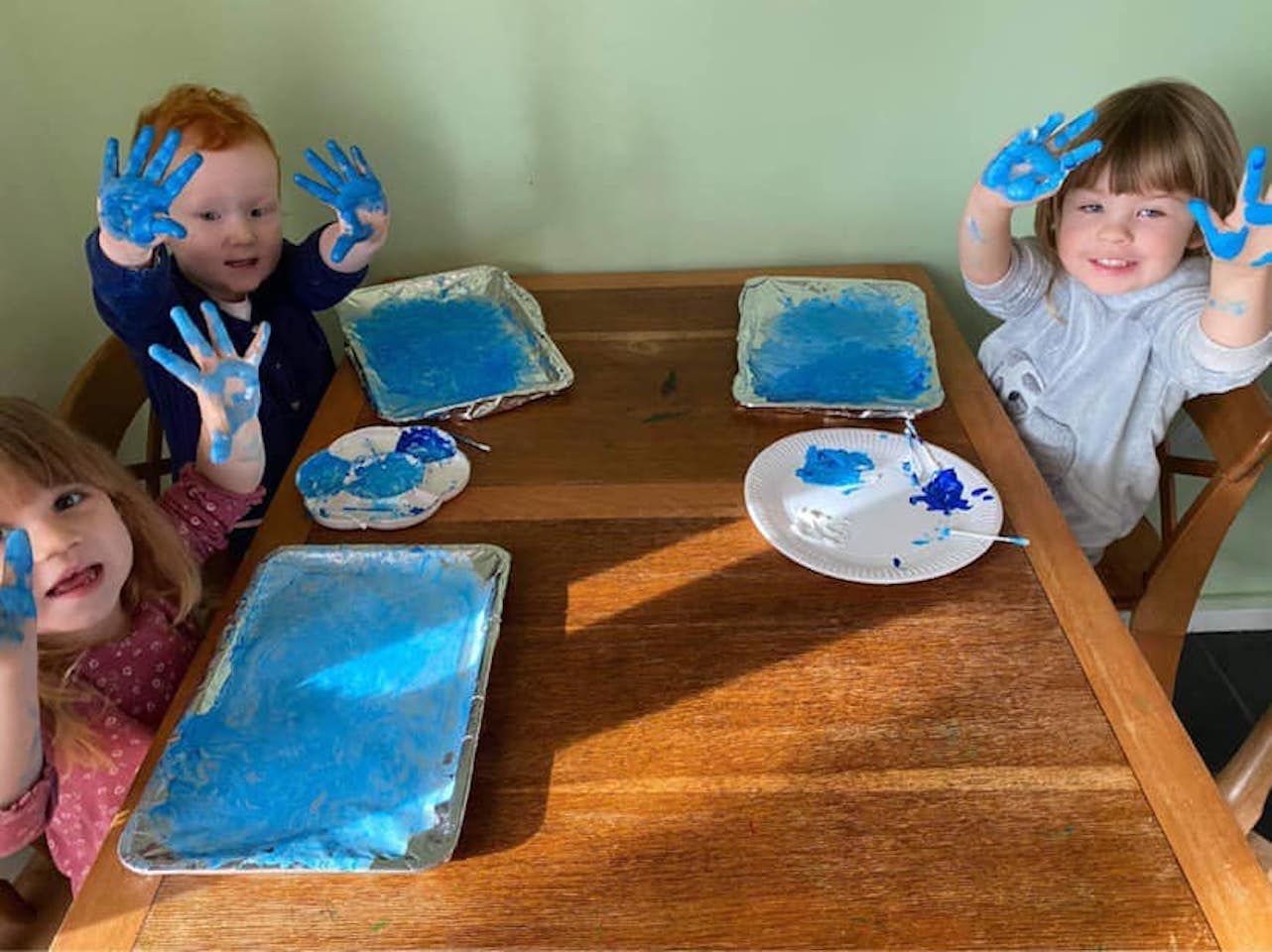 Messy play with blue paint