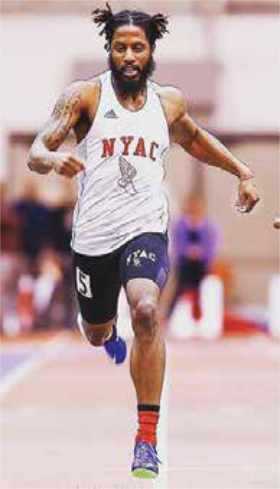 Man running indoor track field Man running indoor track field