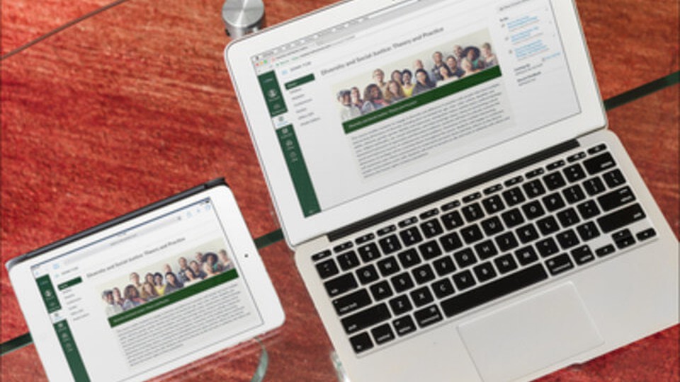 A tablet and a laptop with Tulane University's website opened