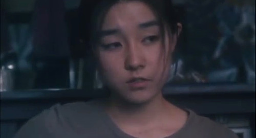A close-up screenshot of a young woman Ageha (played by Ayumi Ito). From the film 'Swallowtail Butterfly'.