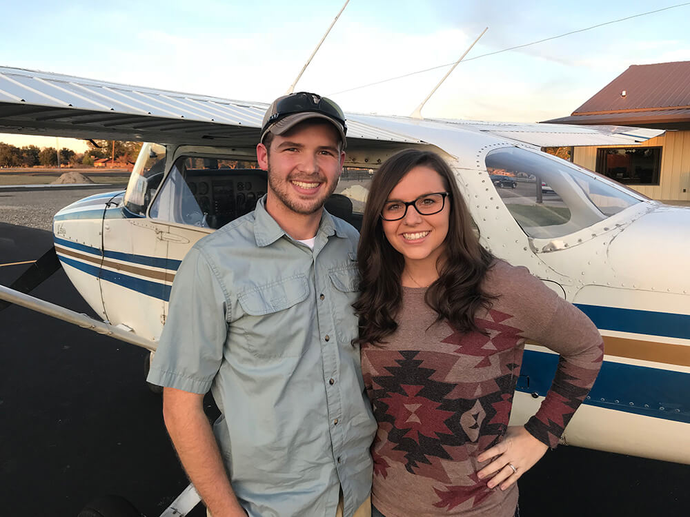 Photo of flight students standing next to a Cessna 172 Skyhawk