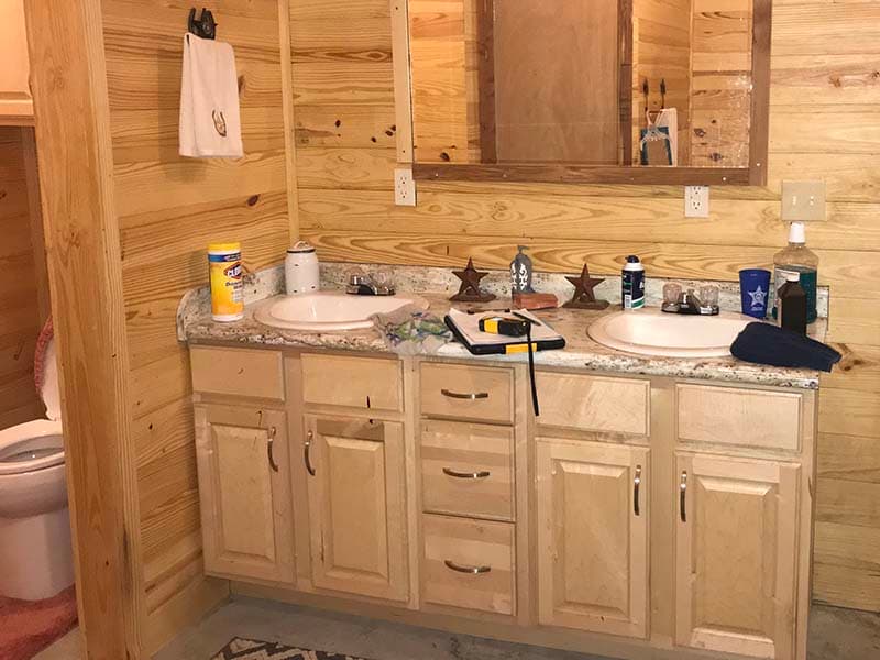 bathroom vanity with double sink before a remodel by CorHome