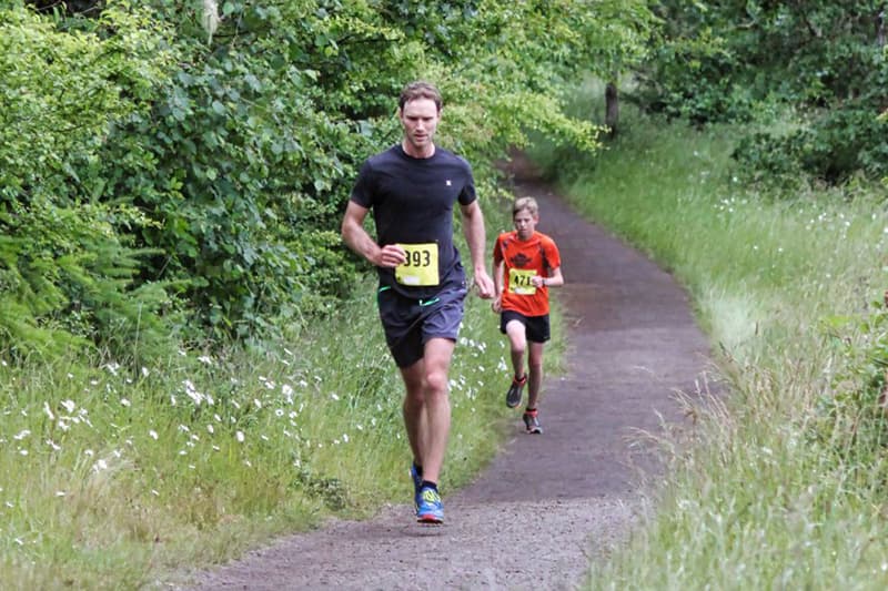 Two 8k runners on Bald Hill section of race