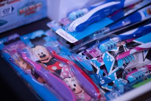 Several kids' tooth brushes featuring various Disney characters at Glenbrook Dental