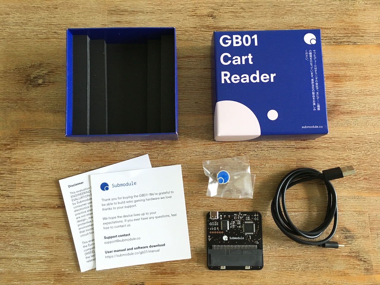 The content of the GB01 Cart Reader box layed out on a table
