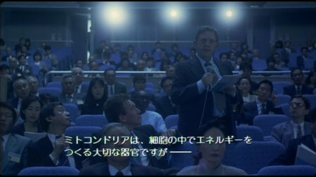An audience member at a talk before Asakura’s stands up and asks a series of questions. It looks as though he is reading the script An audience member at a talk before Asakura’s stands up and asks a series of questions. It looks as though he is reading the script