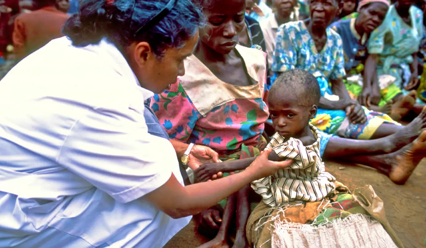 Nurse Sr Walsama checks a malnourished child in the Dowa region of Malawi