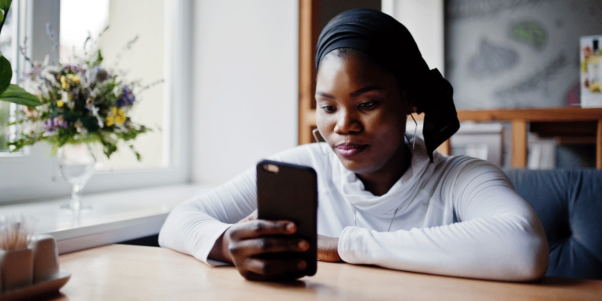 What are mental models in UX design? A UX designer scrolling through a smartphone A UX designer holding a smartphone