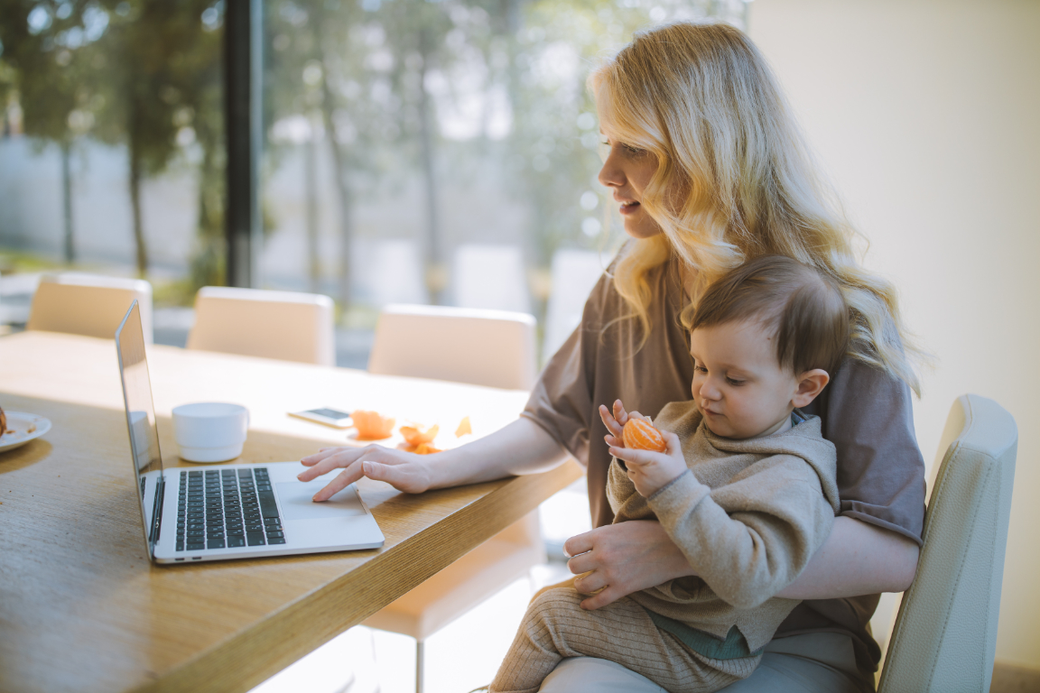 Image - Mother with baby at table with Laptop