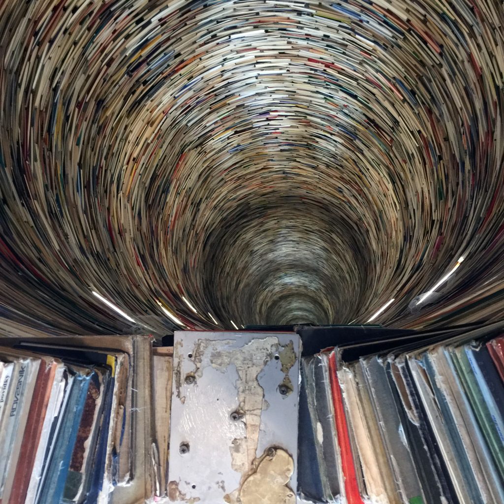 inside a colorful tower made of books
