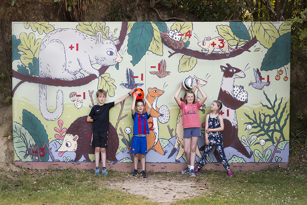 Children in front of a mural