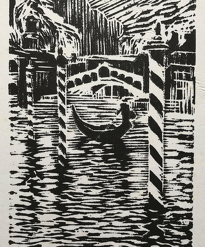 linocut of a Venice gondola on a waterway with bridge behind