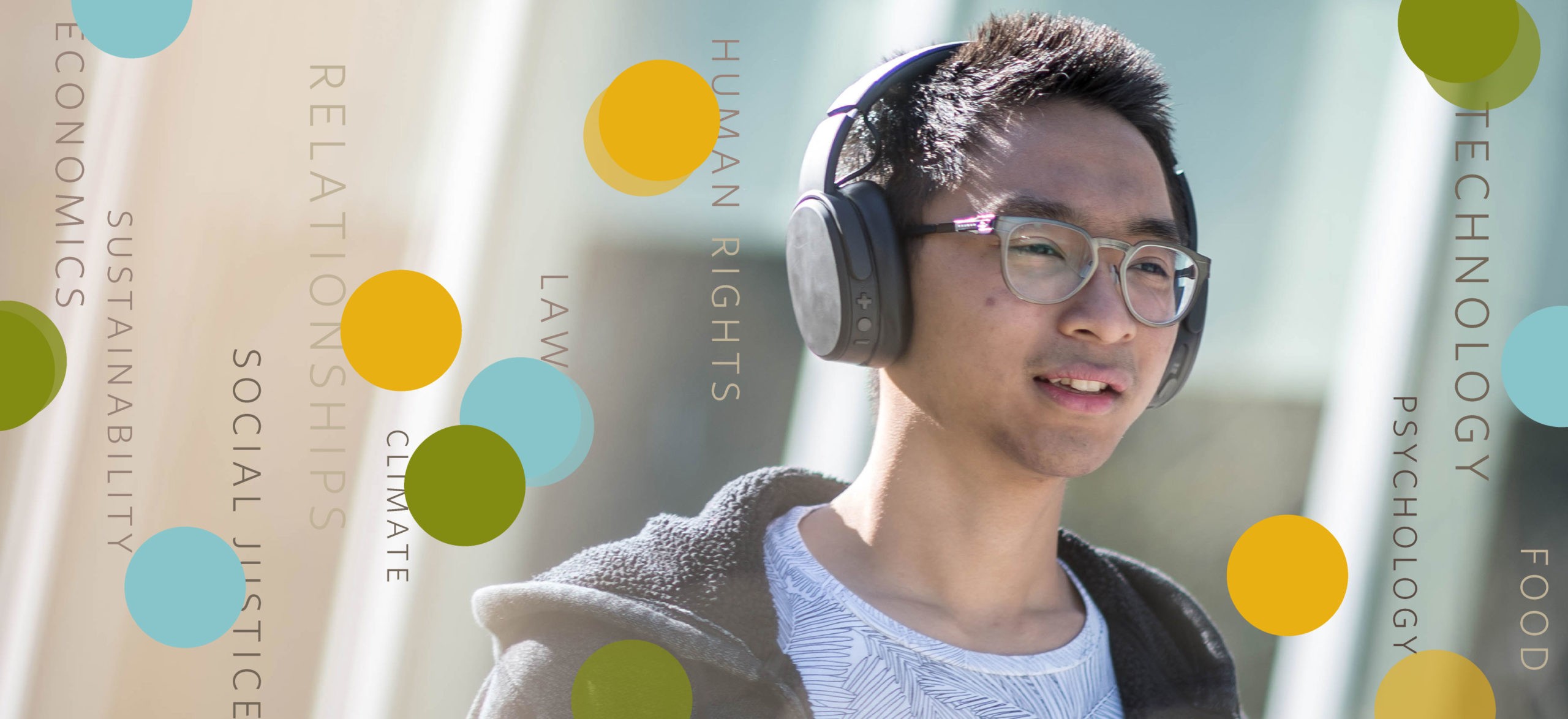 A person listens to UBC talks on his headphones