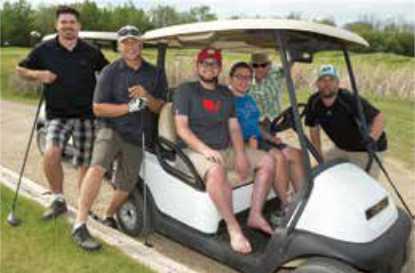 Getzlaff & Friends on golf cart