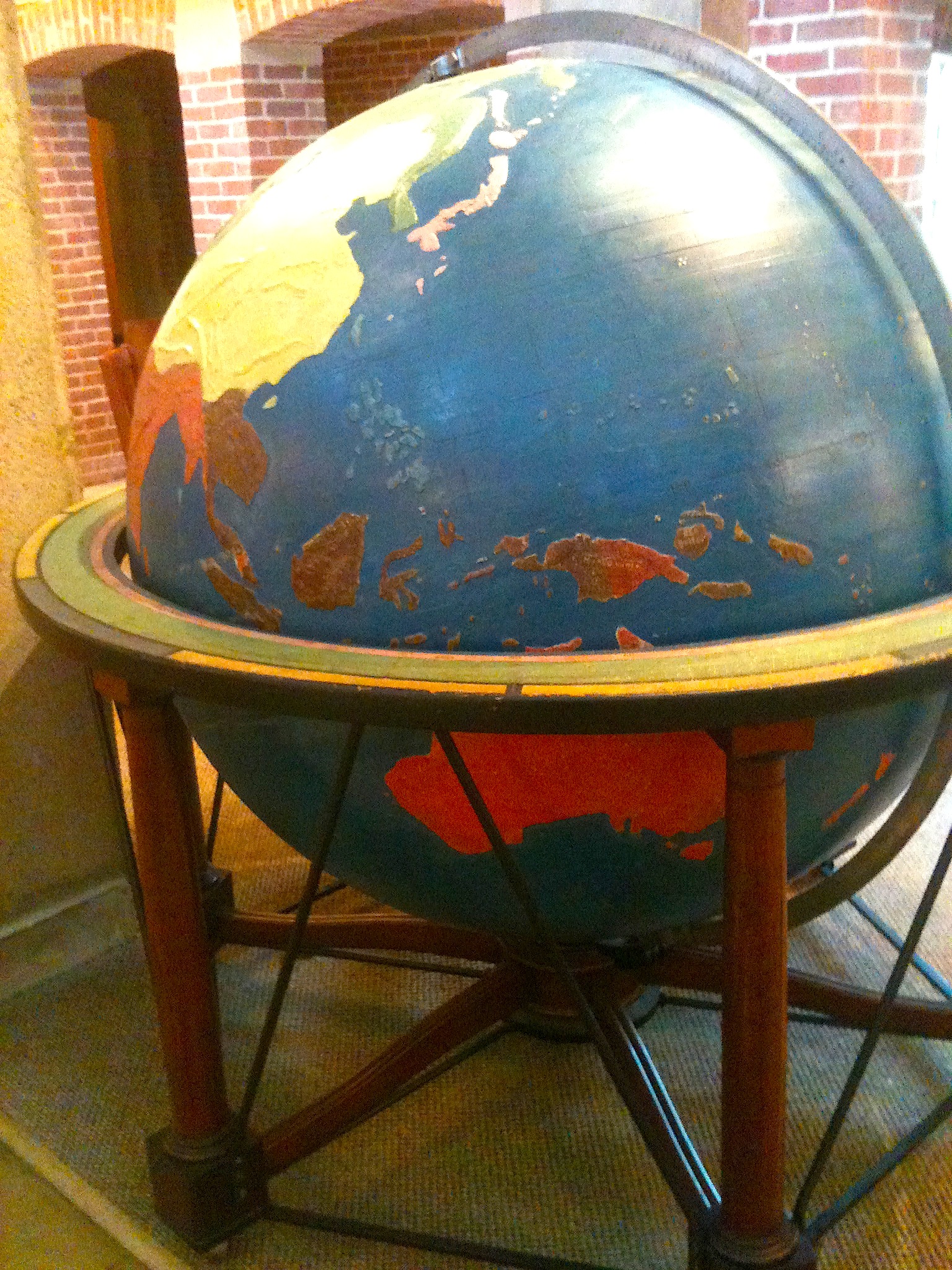 The large-scale haptic globe, with its bumpy mountain ranges and earth formations. It's the size of a small car.