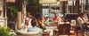 People eating in a sunny outdoor cafe