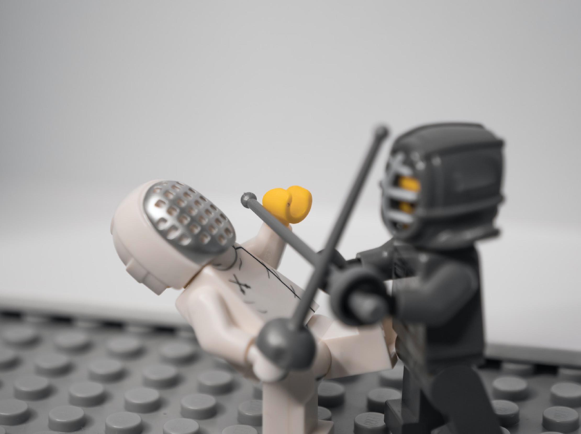 Thumbnail two lego men dueling with swords