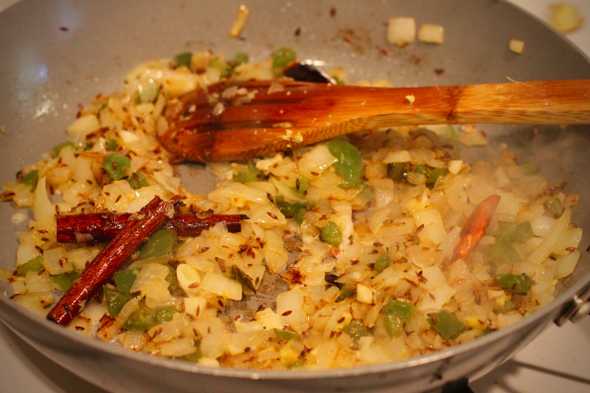 tarka plus onions in the pan