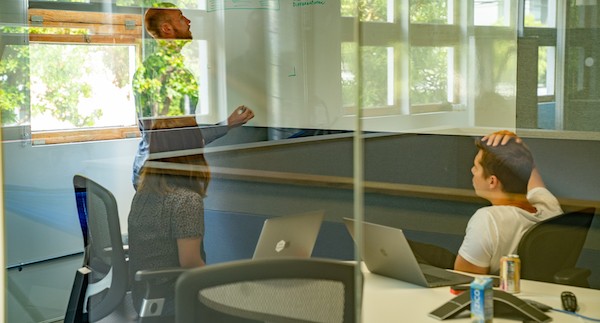 Ouster employees working in a conference room