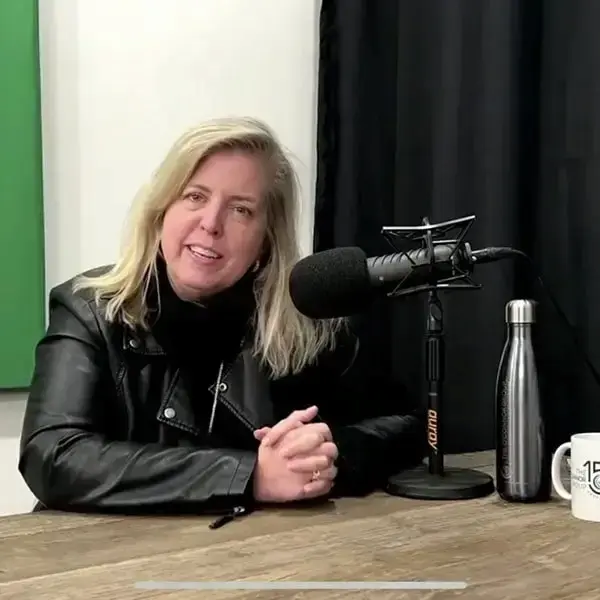 Spokesperson from the O'Connor Group during a podcast that is looking into the camera and smiling.