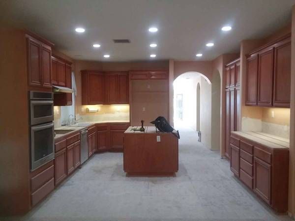 enlarged photo of finished kitchen with newly painted kitchen cabinets and walls