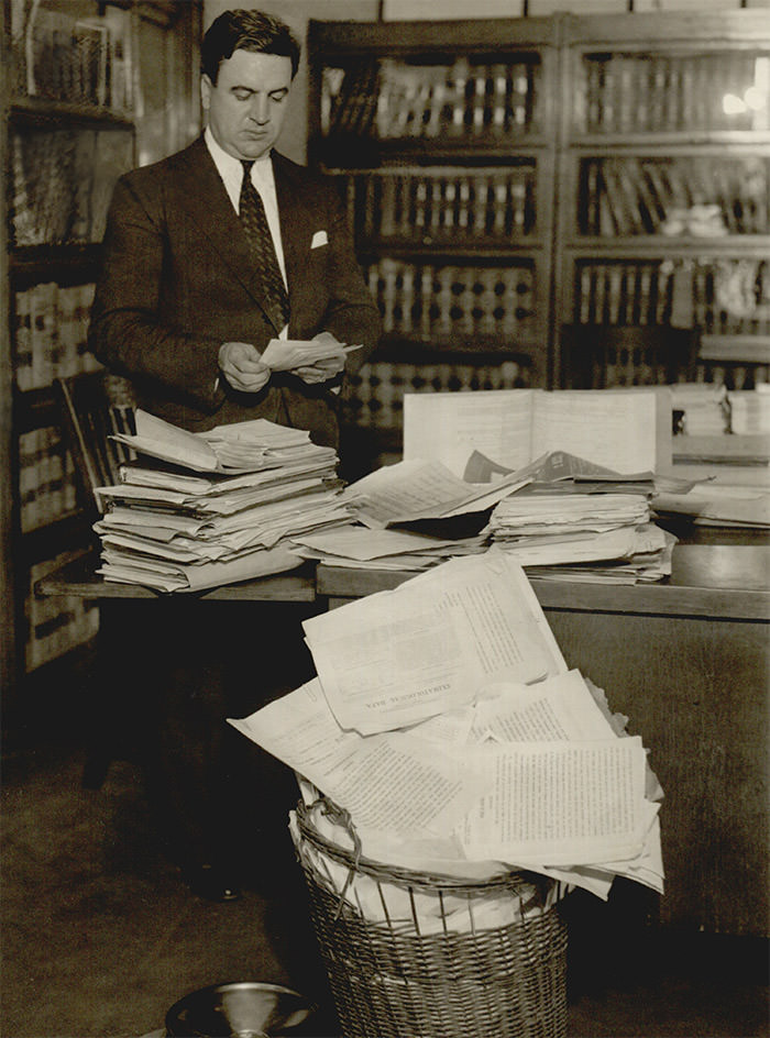 Prosecutor Roy St. Lewis reviewing the voluminous Osage murder case files.