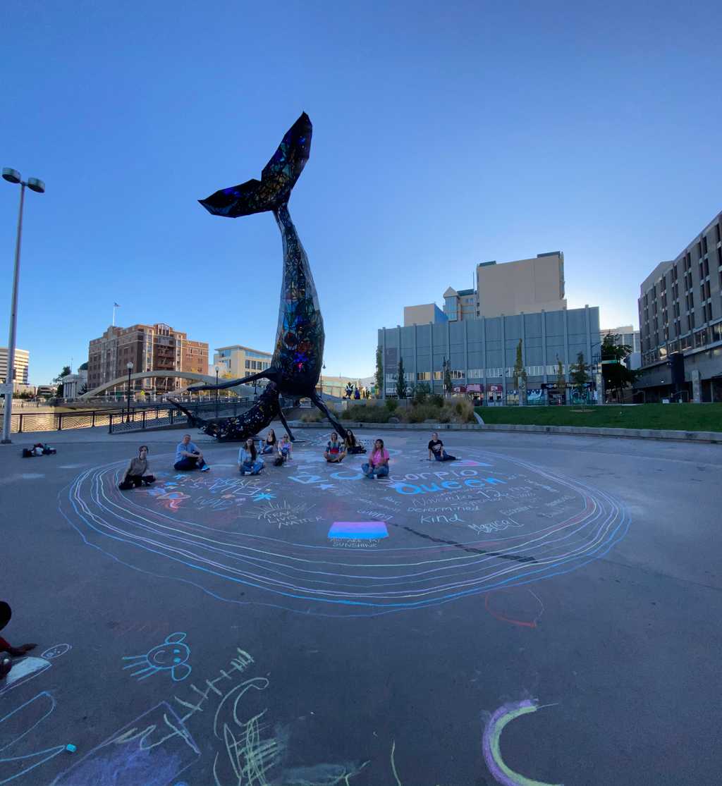 Ella Hamrick's friends and family with their chalk drawings at the Space Whale in Reno