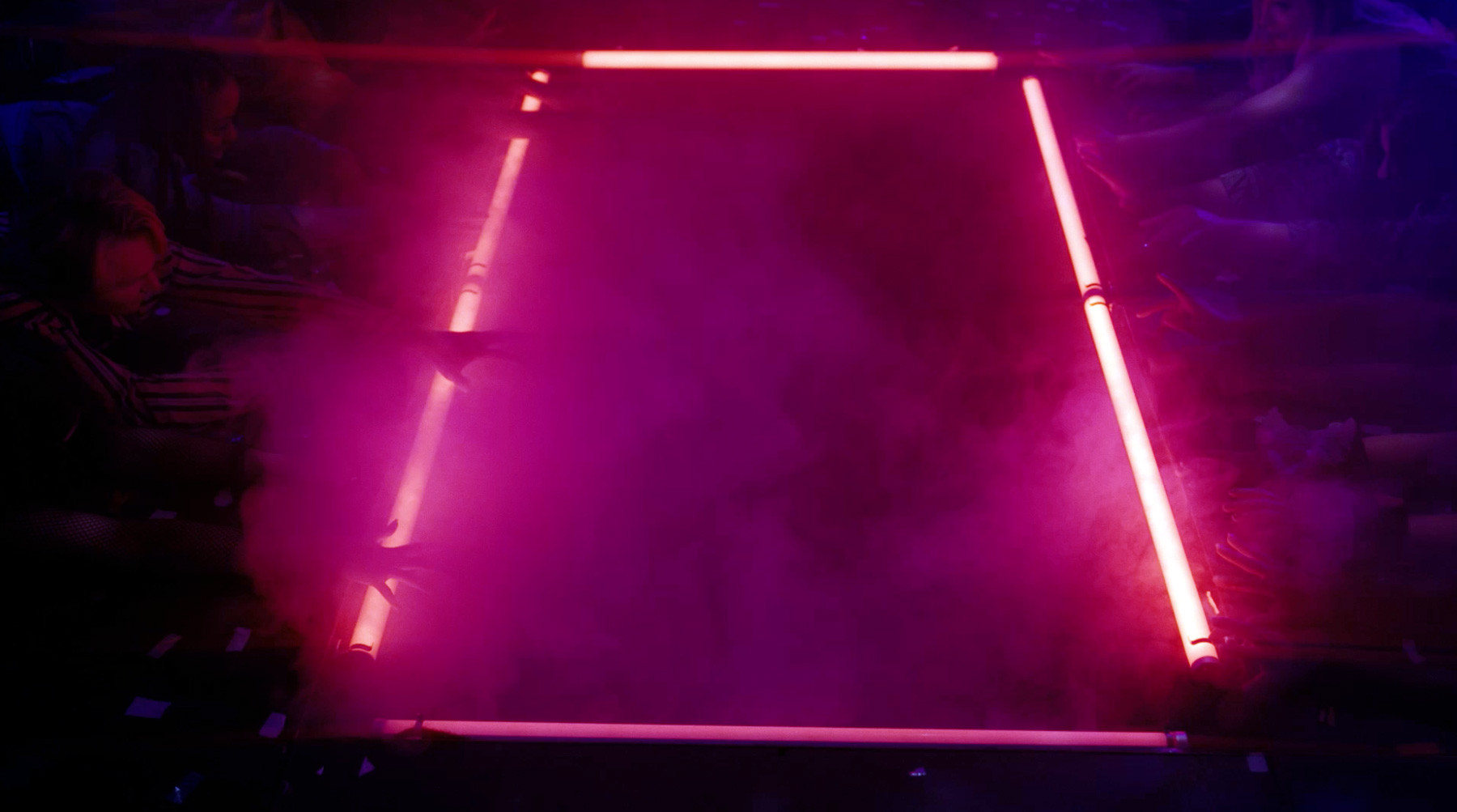 Neon-lit stage at Club Disco Murder.