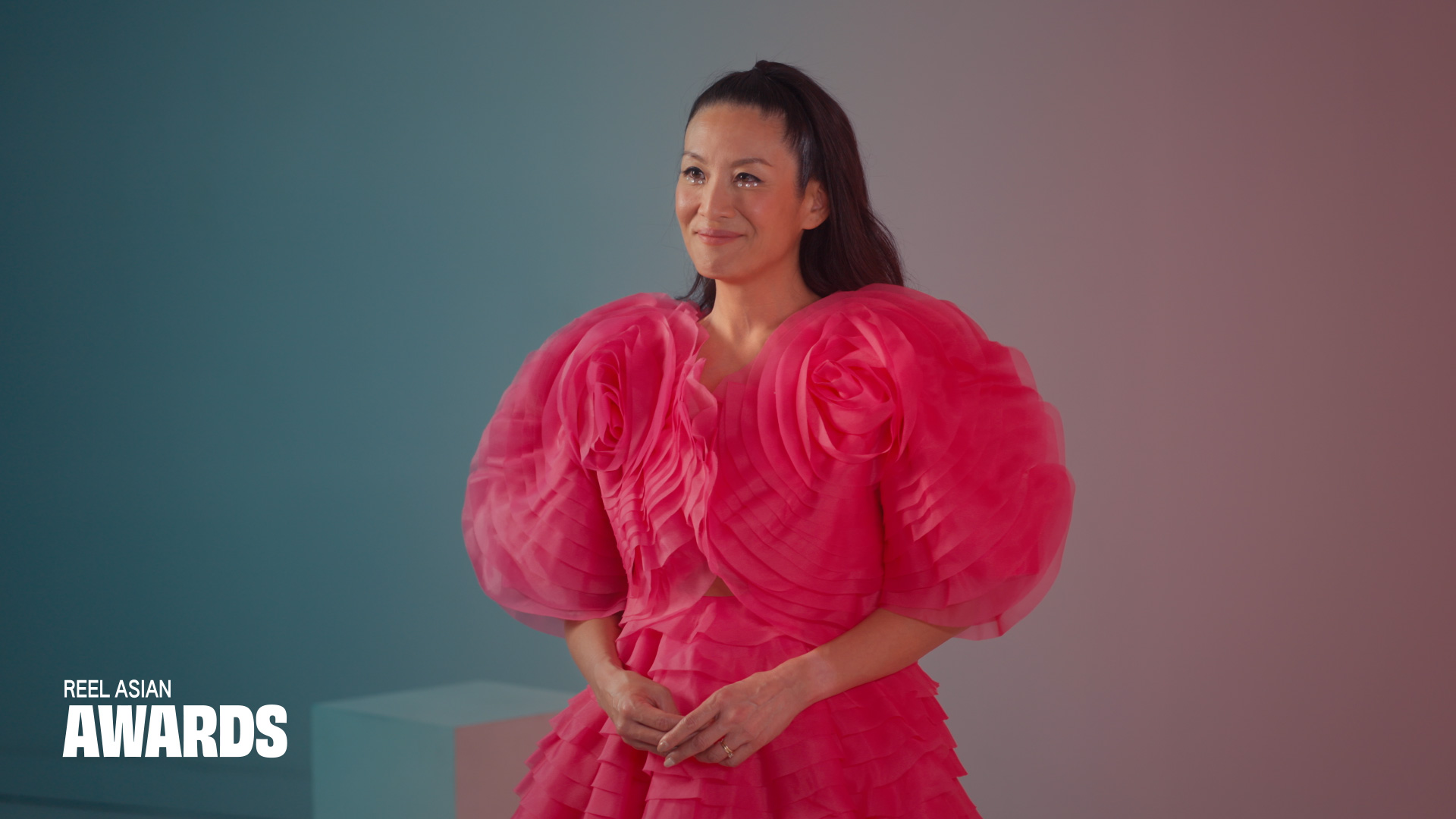 Still from the awards ceremony video, featuring host Lainey Lui